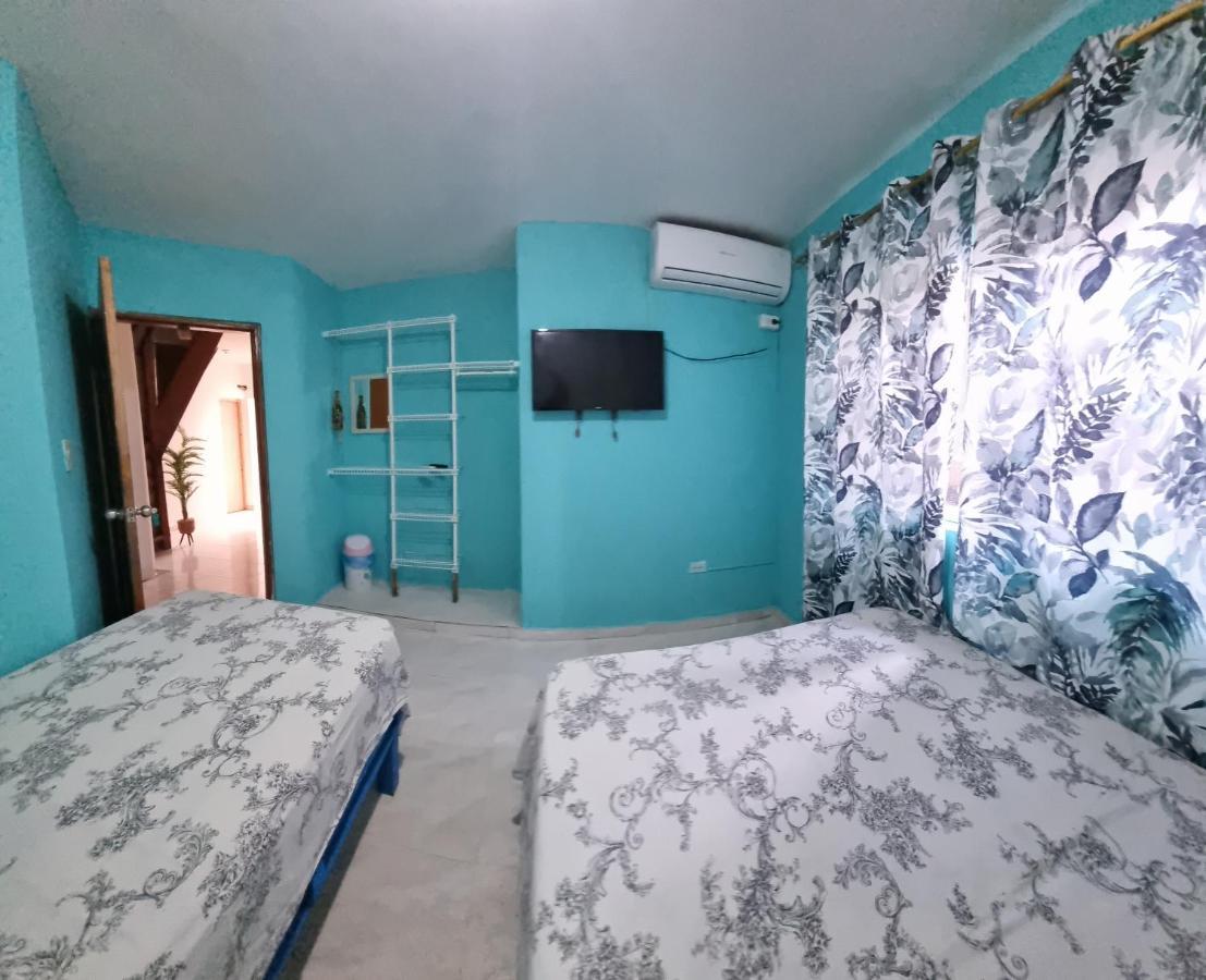 Quarto Triplo com Banheiro Compartilhado